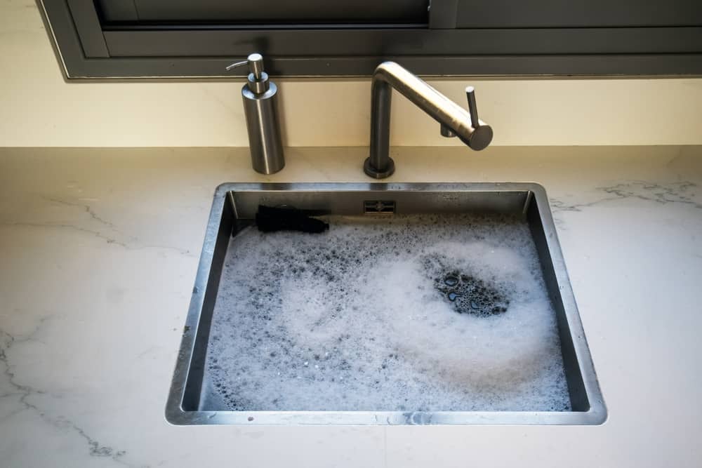 how to clean sink overflow pipe